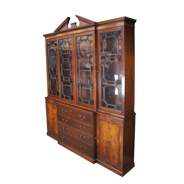 A rare and exquisite early Baker Furniture Manor House Collection George III style Breakfront, circa 1940. Made from...