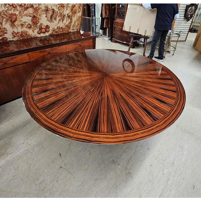 A 21st Century modern Dakota Jackson Heraldic Collection round dining table in great vintage condition. The eye-catching,...