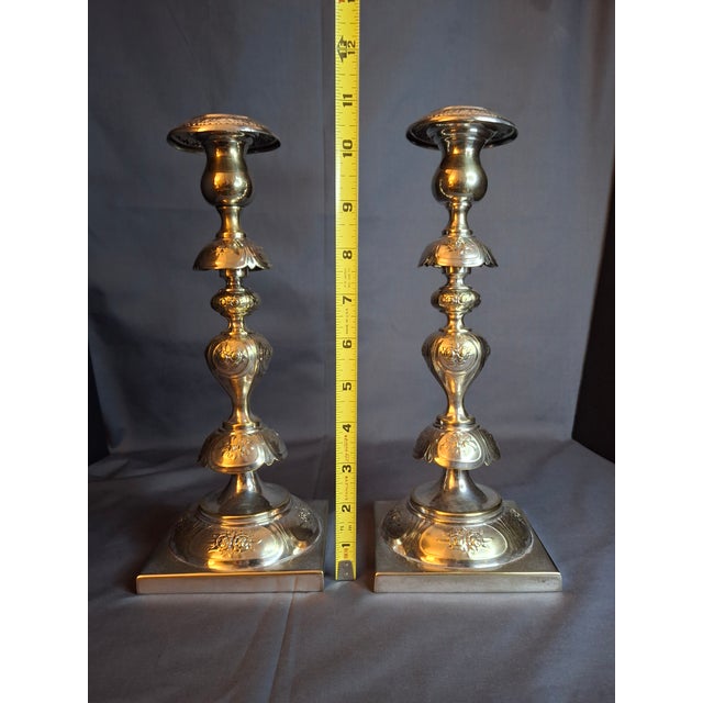 This is a stunning, museum-quality pair of antique Jewish Sabbath (Shabbat) candlesticks by the renowned firm Fraget...