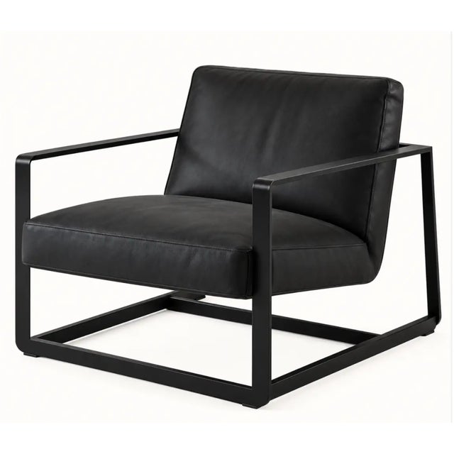 Designed by Vincent Van Duysen for Poliform, this elegant lounge chair features black upholstery and a black painted metal...
