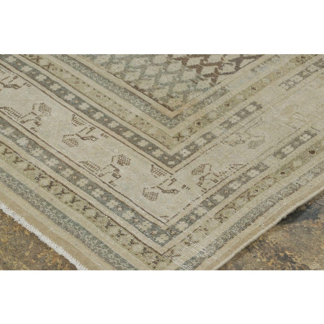 Hand-knotted in wool circa 1910-1919, this 8x11 antique Persian Saraband rug is a striking addition to Rug & Kilim’s...