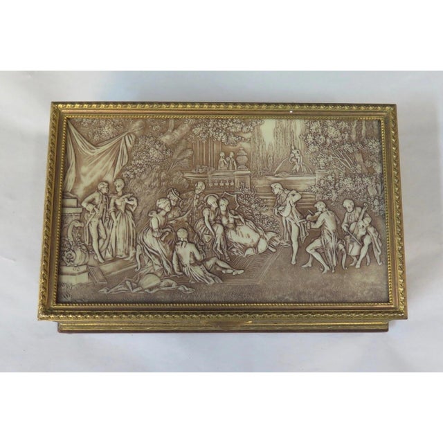 This vintage Continental gilt brass trinket box dates from the late 19th/early 20th century. It is wonderfully decorated...