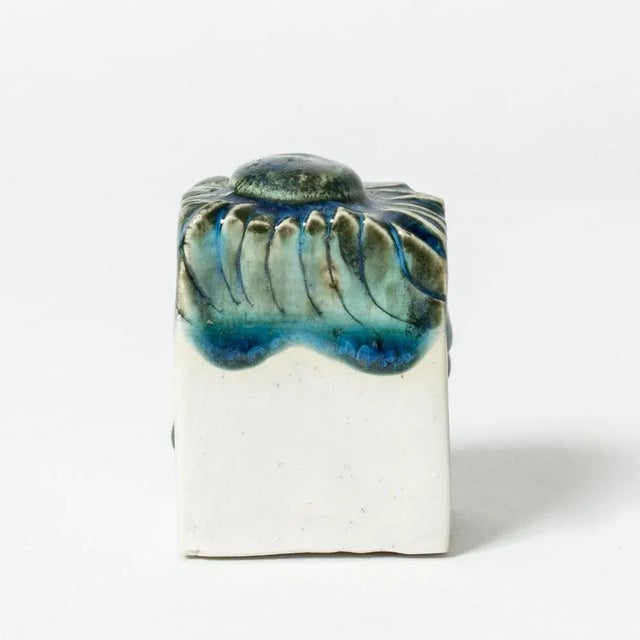 Small stoneware sculpture by Bengt Berglund in a cute, whimsical shape, ocean blue glaze on top, unglazed from the middle...
