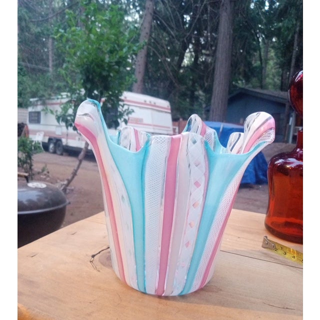 Striking Murano art glass vase, hand-blown in Italy and featuring delicate latticino ribbon work in soft blue and pink...