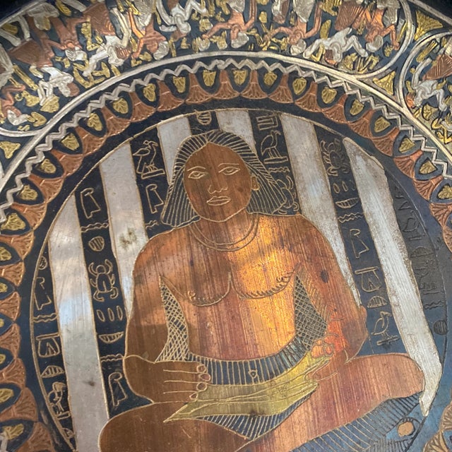 This is a beautiful brass engraved decorative plate. This would look perfect in your house and has great history. Please...