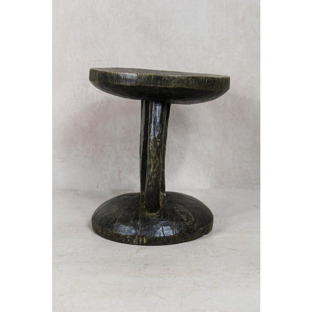 Hand-carved from a single piece of wood, the Tonga stool is a genuine artifact. These stools were status symbols for...