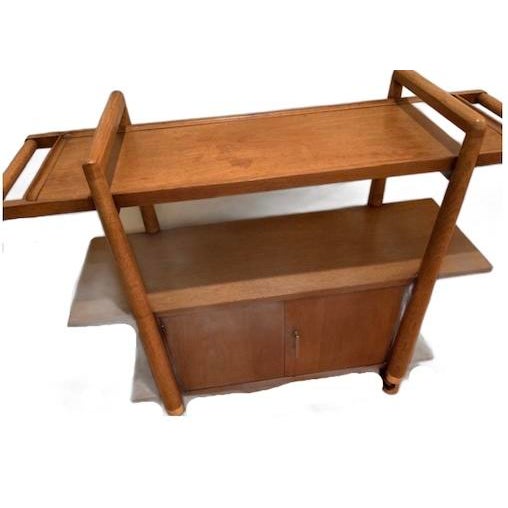 Mid-Century Vintage three tier bar serving cart with storage cabinet on wheels The bar cart has an underneath storage...