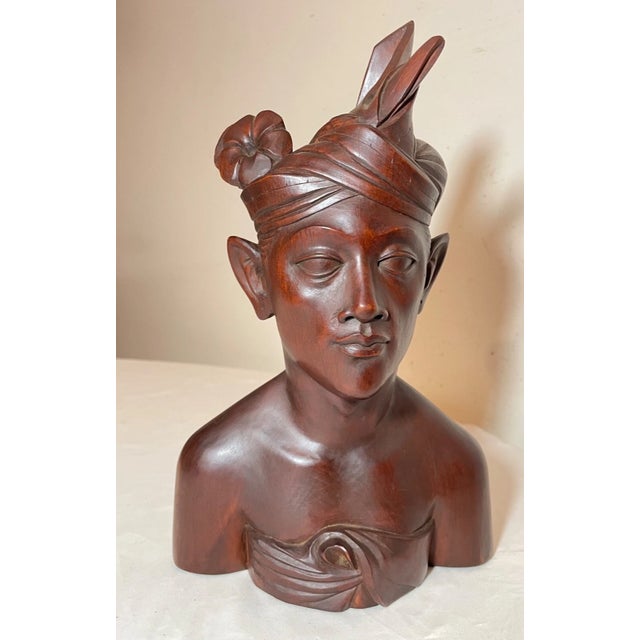 Up for sale is a wonderful antique hand carved wooden Balinese bust sculpture. It's carved by hand out of a very dense,...