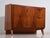 Vintage asymmetric sideboard veneered in walnut and raised on splayed legs, made in czechoslovakia around 1960. A mid-...