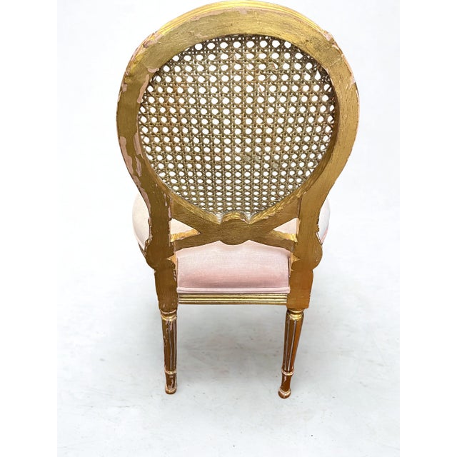 Louis XVI‑Style Cane Back Accent Chair in Gold Finish Beautiful vintage Louis XVI–style accent chair featuring a round...