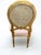 Louis XVI‑Style Cane Back Accent Chair in Gold Finish Beautiful vintage Louis XVI–style accent chair featuring a round...