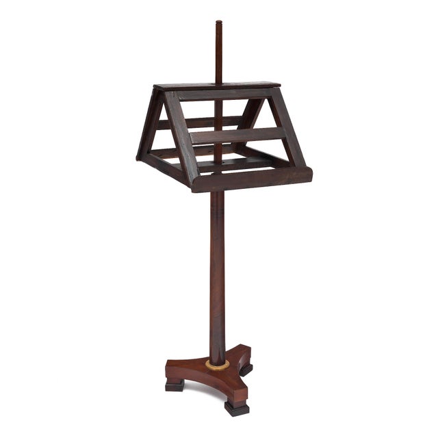 Early 19th century French Empire walnut lectern featuring a rotating stand. The solid walnut is hand-carved into a single...