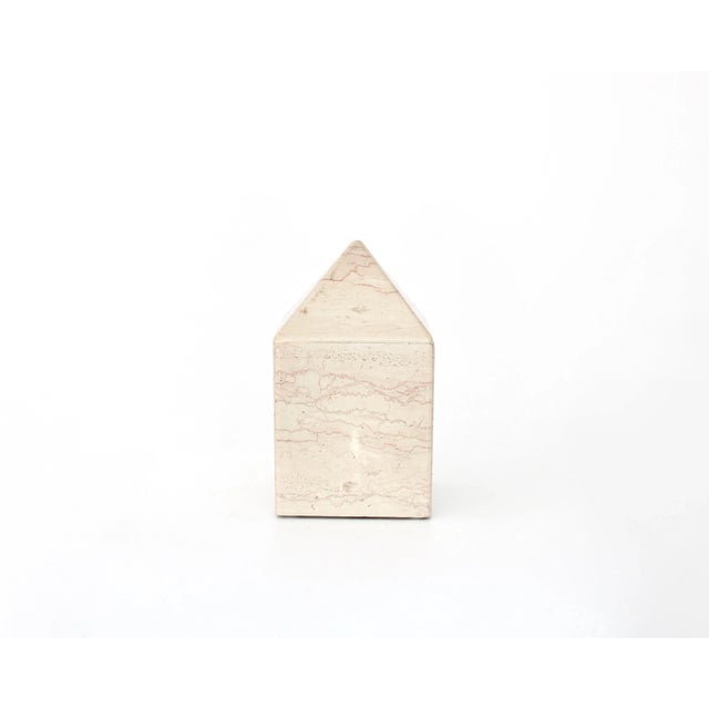 Italian cream pale marble obelisk composed of pieces of marble laminated together to compose the obelisk. Hollow on the...