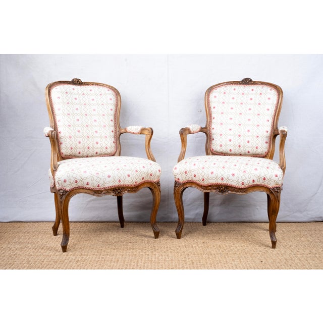 A pair of antique armchairs, late 19th century, French. Louis XV style fauteuils. Seat, back (front panel), and arm pads...