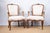 A pair of antique armchairs, late 19th century, French. Louis XV style fauteuils. Seat, back (front panel), and arm pads...