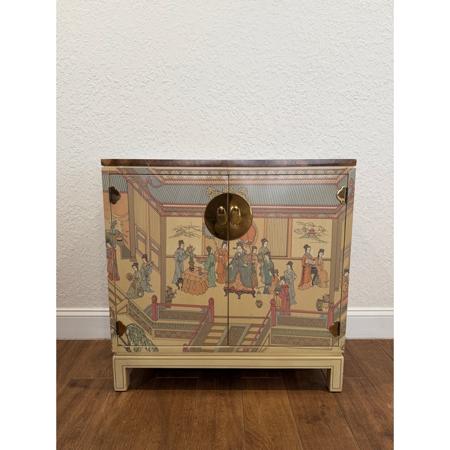 A gorgeous Hollywood Regency Chinoiserie Bar Cabinet by Drexel Heritage. USA, Circa 1980s. Cream lacquered mahogany, with...