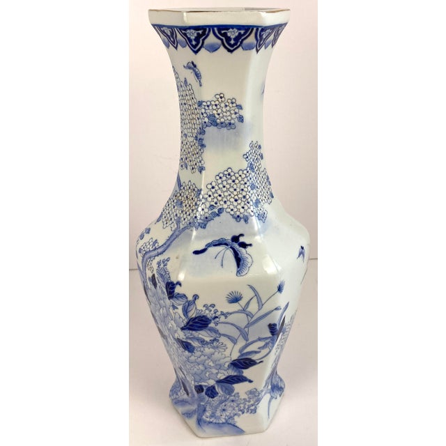 A refined pair of antique Chinese blue and white porcelain vases, showcasing the exceptional artistry and craftsmanship...