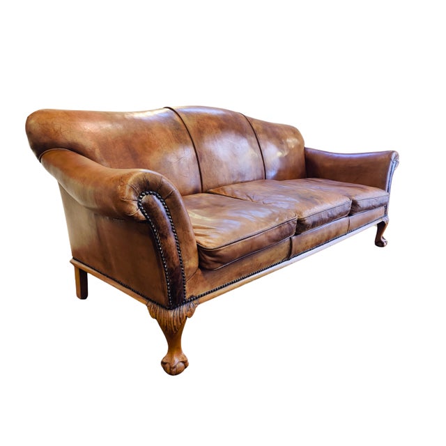 This Art Deco three-seat sofa dates from the 1930s and is upholstered in sheep leather that has developed a warm and...