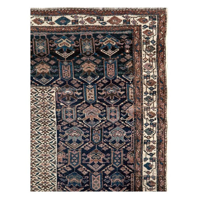 An antique Persian Kurdish accent rug handmade during the early 20th century. Measures: 6' 0" x 9' 5".