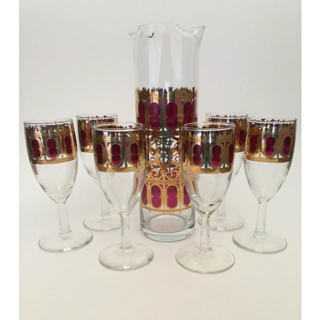 Cranberry Scroll Pitcher Set with six stemmed glasses. A festive taste of cranberry joy for your sideboard perfect for an...