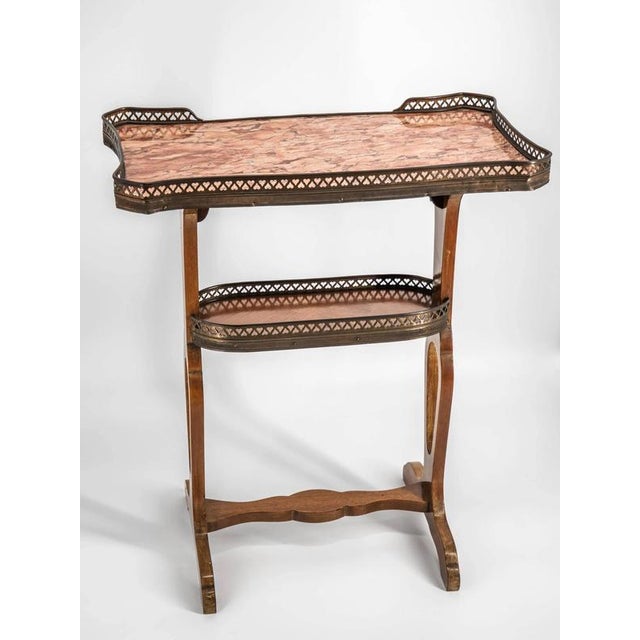 This beautiful antique table from around 1920 is an exceptional piece of furniture that combines elegance with...
