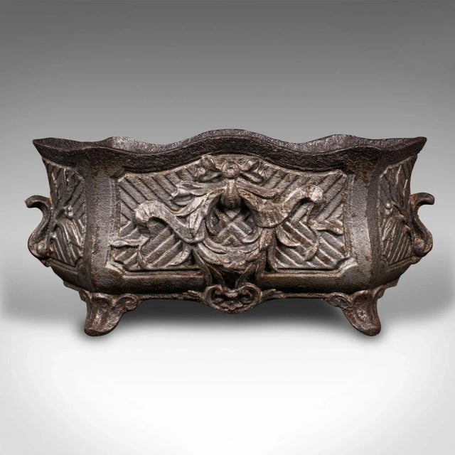 This is an antique Art Nouveau planter. A French, cast iron windowsill or outdoor jardiniere, dating to the late Victorian...