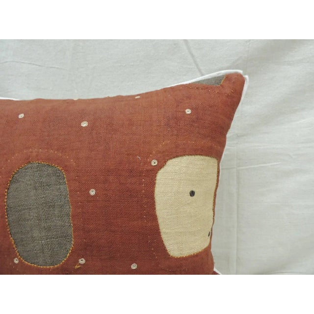 Applique raffia, patchwork and applique brown, rust and natural decorative pillow with, Custom flat cotton trim in earth-...