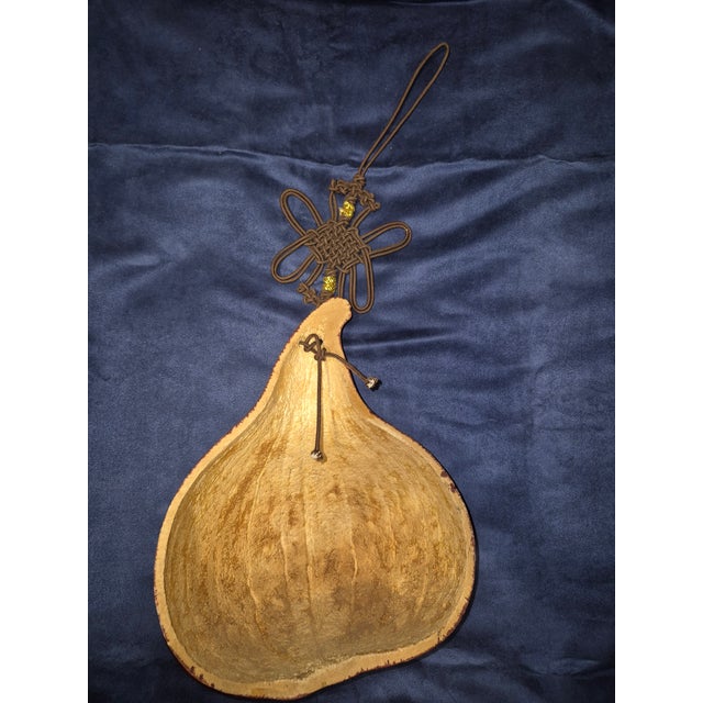 Add a touch of East Asian heritage to your walls with this unique, vintage hand-painted decorative gourd. Crafted from a...