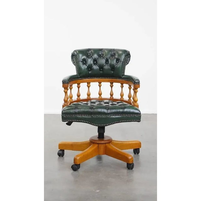 Offered this green classic and timeless chesterfield office chair made of cowhide leather on wheels. This nice green...