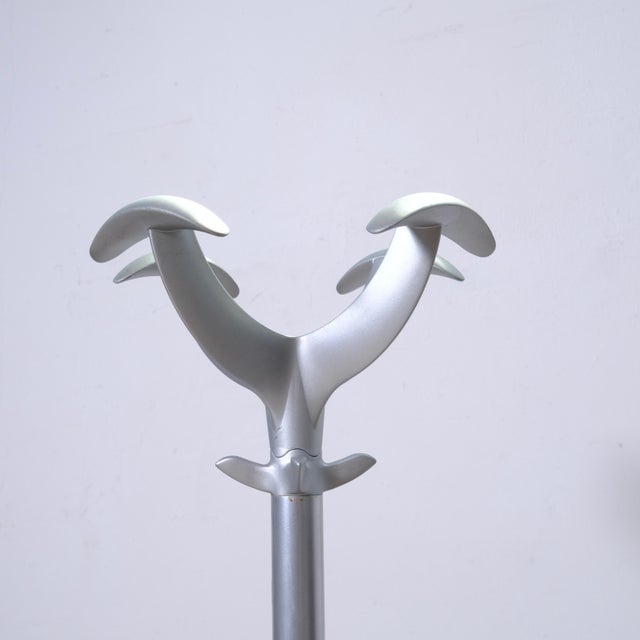 This detail shows the branding imprinted on the base of the Cactus coat rack (model 1070). This is a famous icon of...