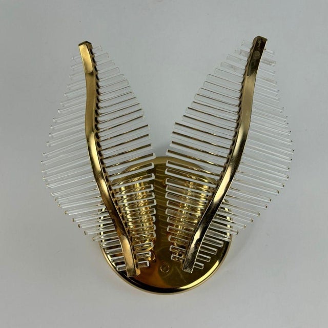 Special Venini palm-shaped 2 "side" wall lamp, made of Murano glass tubes with a gilded metal structure. An iconic...