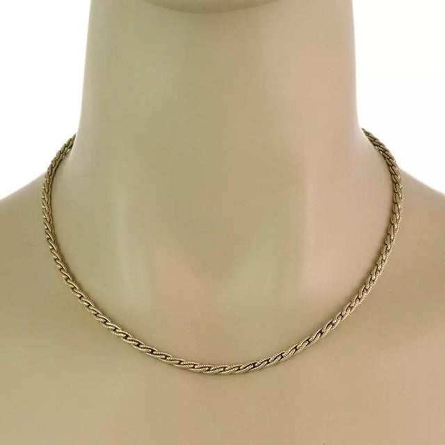 This authentic chain is from Tiffany & Co. It is crafted from 14k yellow gold featuring a shiny fine milgrain textured...