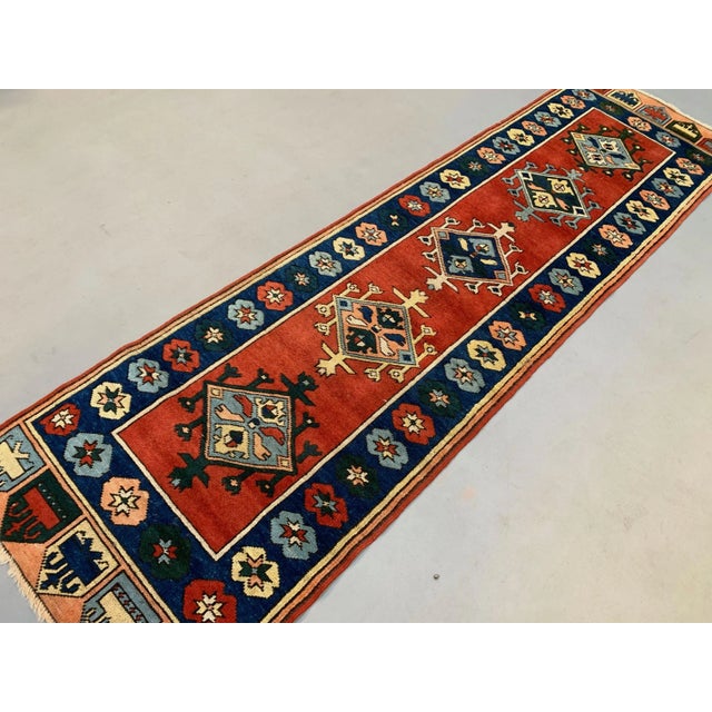 Beautifully woven hand knotted Turkish Runner from 1960s with a repeating diamond pattern. Knotted tightly on a cotton...