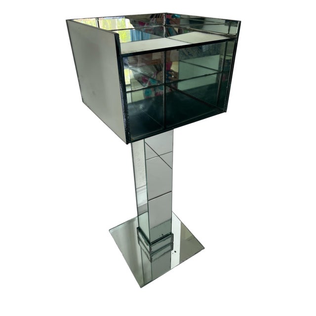 Art Deco Mirrored pedestal drinks table. Top measures 12"x12" and there is a place to put items under top shelf....