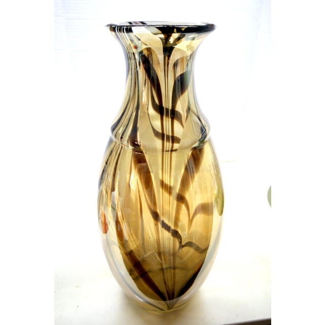 This elegant 14-inch Italian art glass vase is an exceptional addition to any setting, serving as a seamless anchor for...