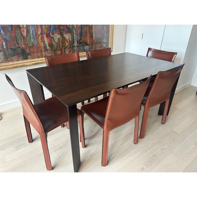 6 original Cab dining chairs designed by Mario Bellini, manufactured by Cassina. Russian red leather. These chairs are 45...