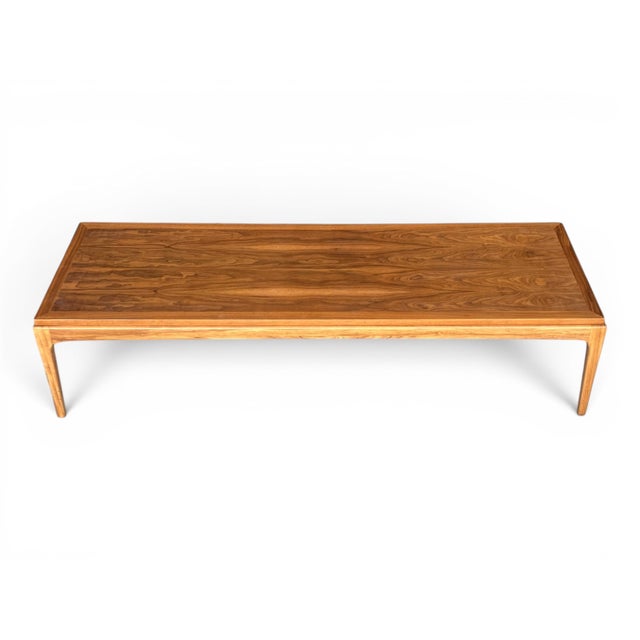 This elegant Mid-Century Modern coffee table showcases the clean lines, understated sophistication, and timeless...