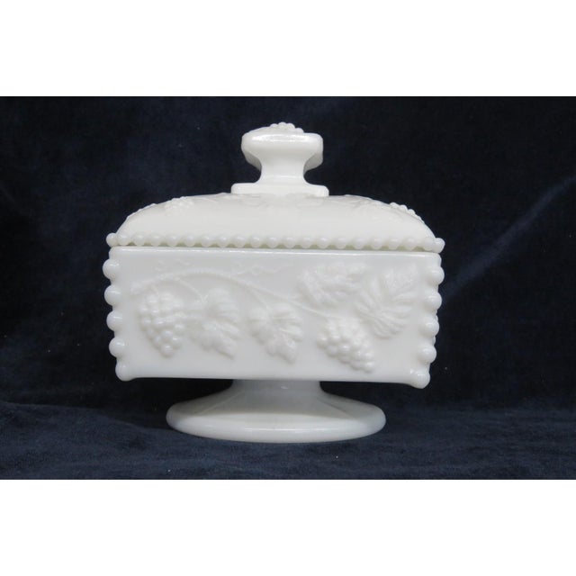 This lovely lidded Candy Dish is made out of white milk glass. This Candy Dish appears to have been made in the Beaded...