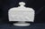 This lovely lidded Candy Dish is made out of white milk glass. This Candy Dish appears to have been made in the Beaded...