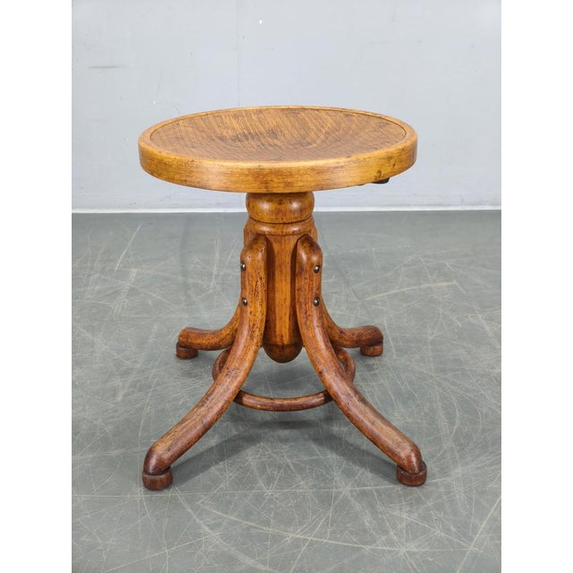 Original swivel piano stool manufactured by Thonet in Czechoslovakia during the 1930s. Crafted from beech wood and beech...