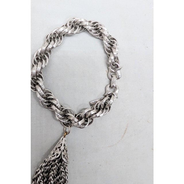 Vintage 1960s Signed Monet Rhodium Plated Tassel Charm Bracelet For Sale In Philadelphia - Image 6 of 8