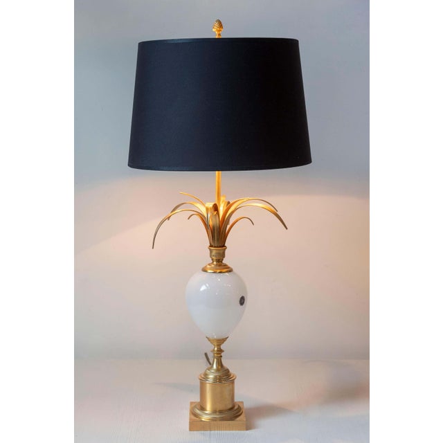 This striking 20th-century French lamp combines timeless elegance with bold, sculptural design, making it a standout piece...
