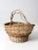 This rustic vintage woven basket is a great decorative catchall for the home. The large wicker basket showcases braided...