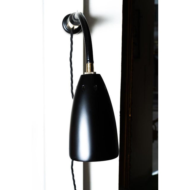 Magnetic industrial wall or table lamp from Germany around 1950s. Original condition. European Plug (up to 250V).The...