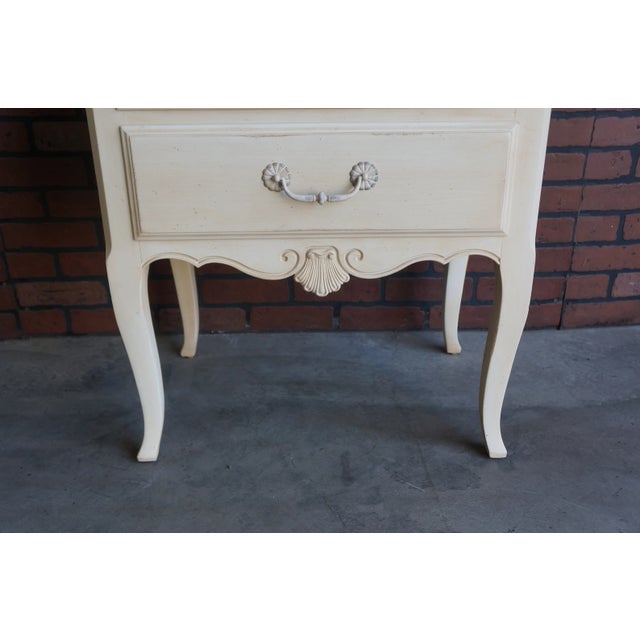 Provincial artistry combines with superior craftsmanship in this nightstand by Ethan Allen. Romantic and timeless the...