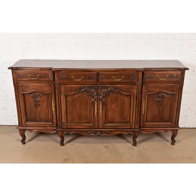 An outstanding French Provincial Louis XV style sideboard buffet, credenza, or bar cabinet In the manner of Karges France,...