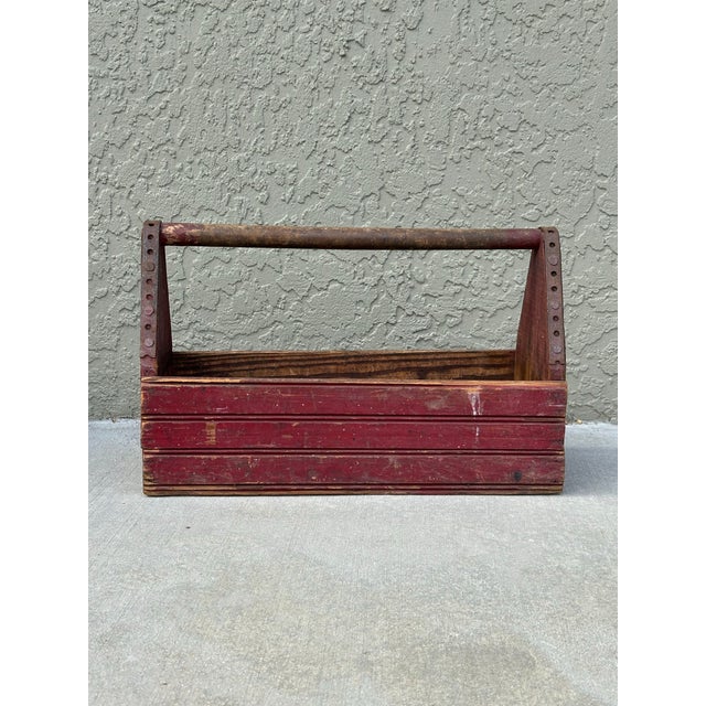 Antique solid wood tool caddy with removable metal divider. Red. Measures 20” x 7 1/2” x 12”.