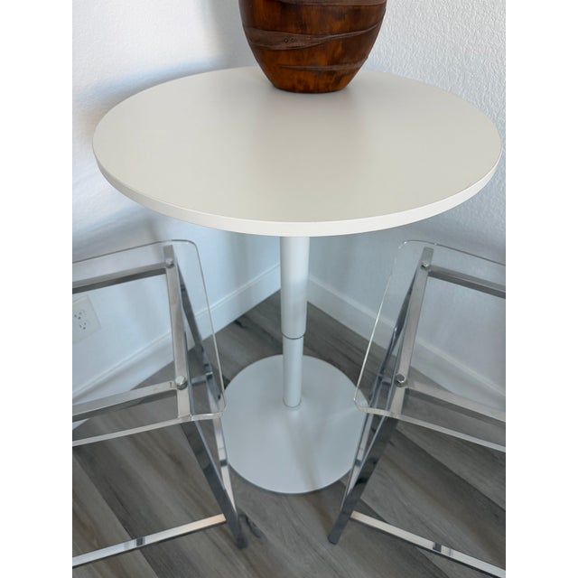 No fabric, no leather, just one clean swoop of clear, thick acrylic exposing architectural chrome plated square steel...