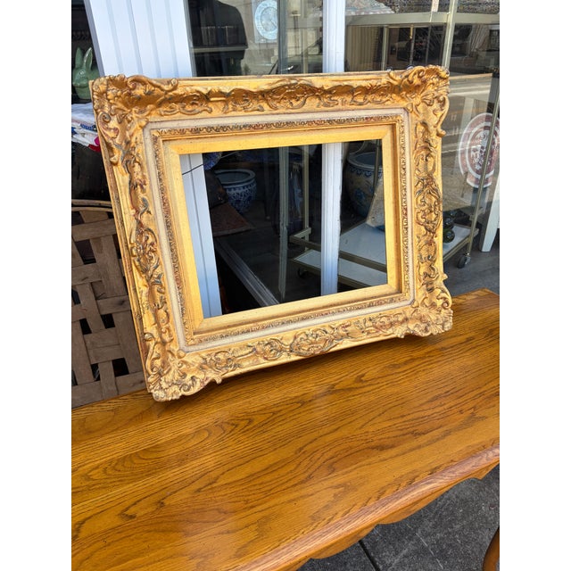 Ornate Gold Wood Frame in a Decorative Rococo Style . Frame outside dimensions 21 tall x 25 wide x 3 deep. Inside opening...