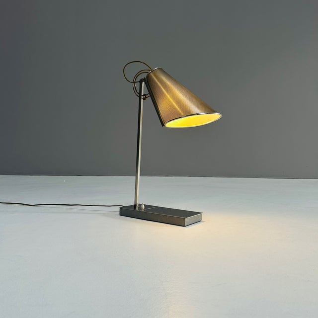 Table lamp called "Compass Dans L'Oeil" by Andreé Putman for Baldinger & Sons with a perforated metal shade. Sold through...
